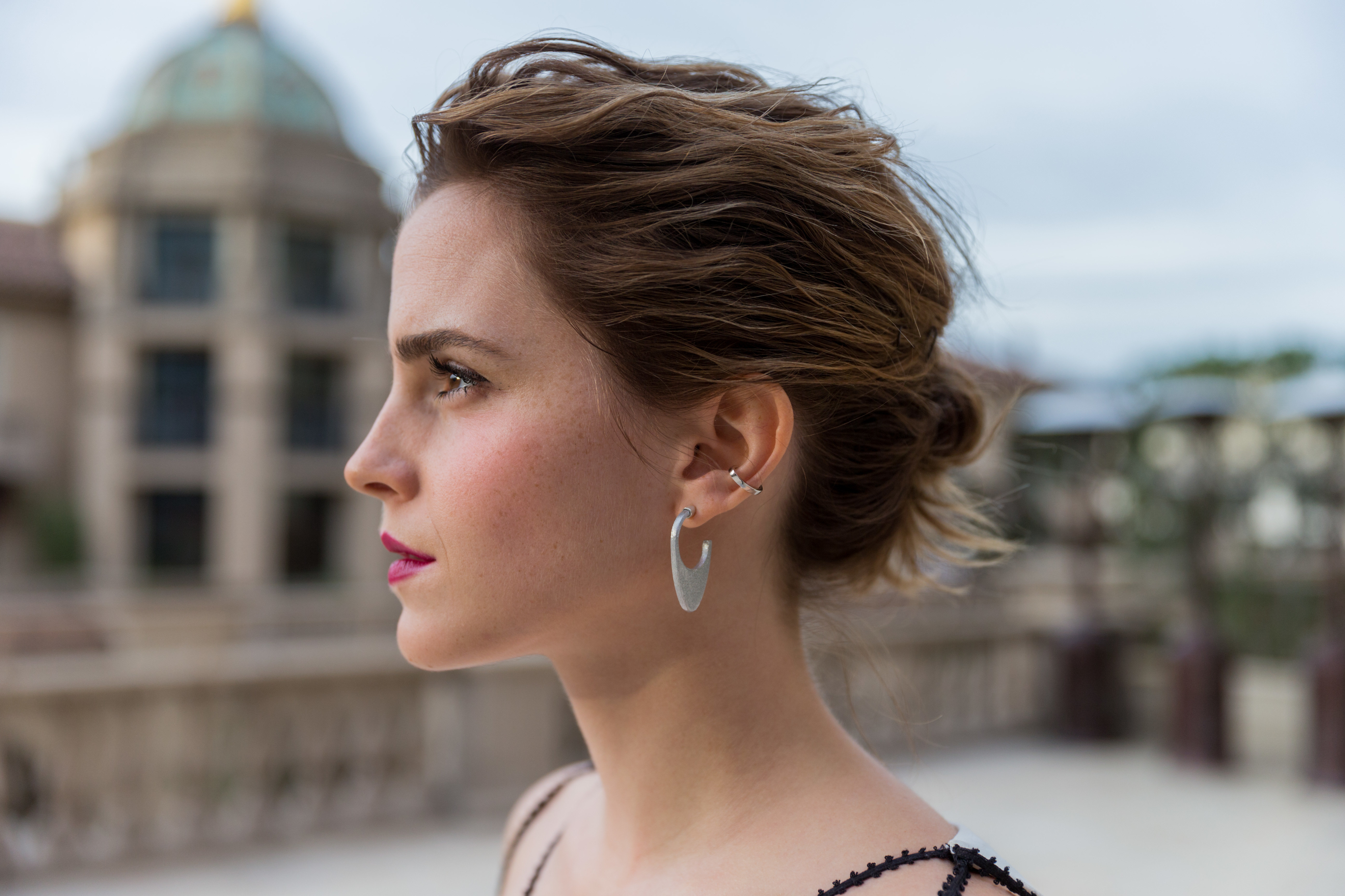 Wallpaper Actress Emma Watson face side view.