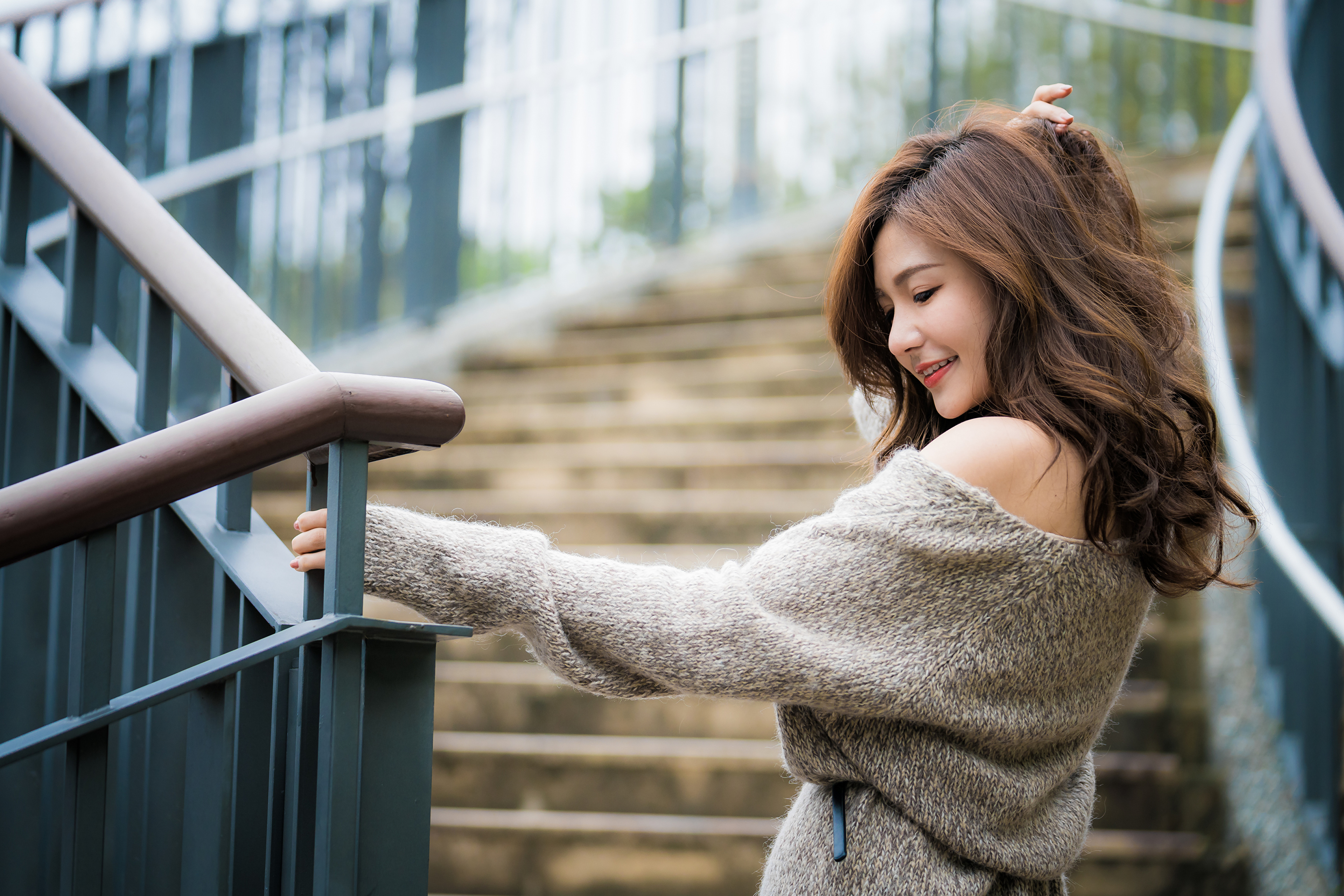 Wallpaper Beautiful Asian girl in a gray sweater on the steps.